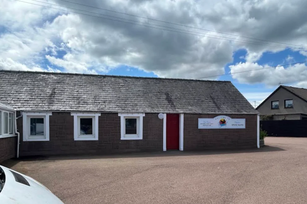 The stone-built Chic Rustic Bistro & Gift Emporium at Tayock Holiday Park, with its red front door