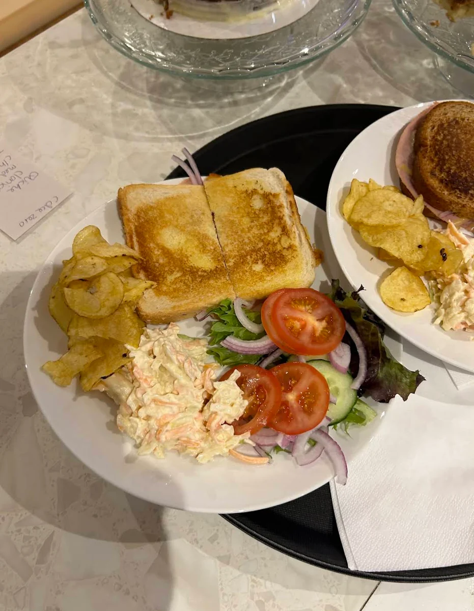 Golden toastie with side salad, coleslaw and crisps